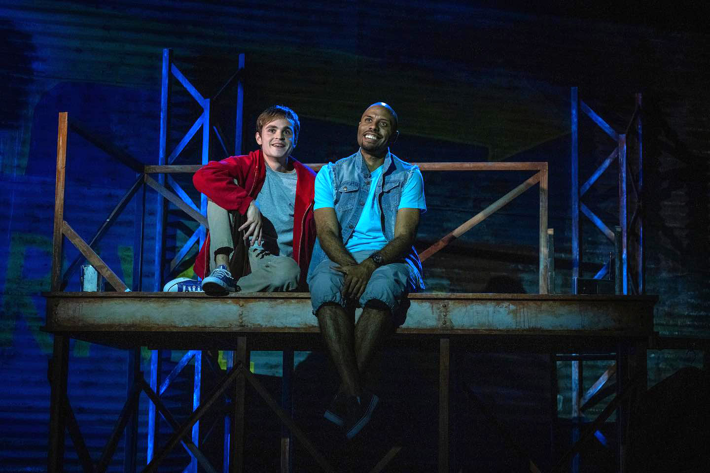 picture of 2 actors, one young & white male, one older & black male on a scaffoldig in MONSTERS OF THE AMERICAN CINEMA